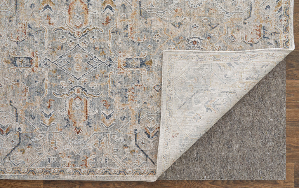 8' X 10' Ivory Tan and Blue Abstract Power Loom Worn Faded Area Rug With Fringe